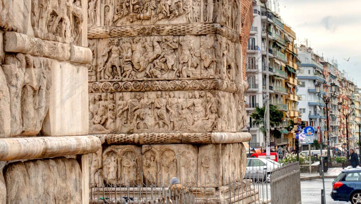 Detailed stone carvings on the historic Arch of Galerius in Thessaloniki.